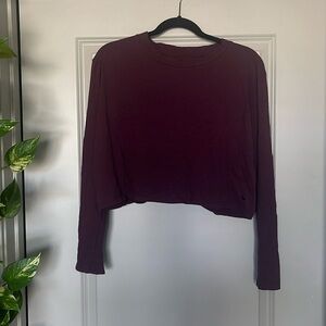 Pink cropped long-sleeve t-shirt, size M, 100% cotton, good condition.